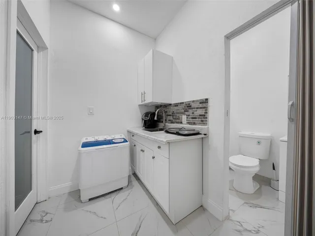 a bathroom with a sink a mirror and a shower