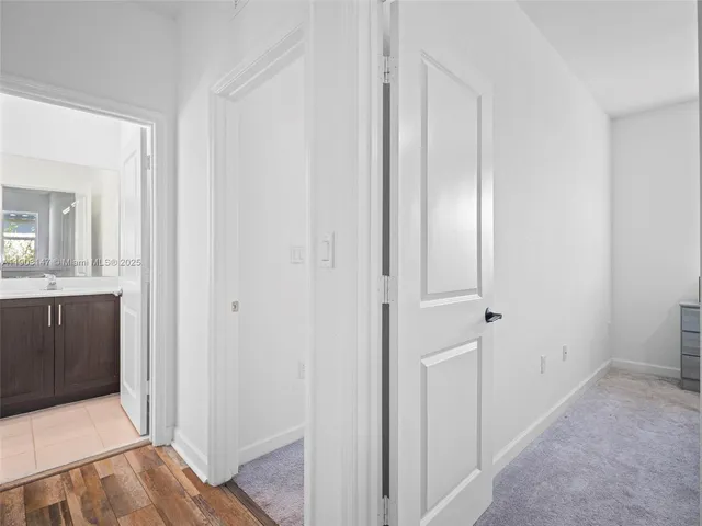 a view of a storage and utility room with washer and dryer