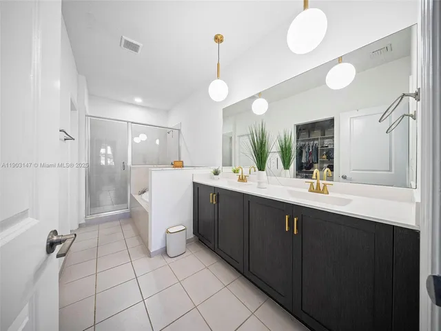 a view of a hallway with wooden floor and entryway
