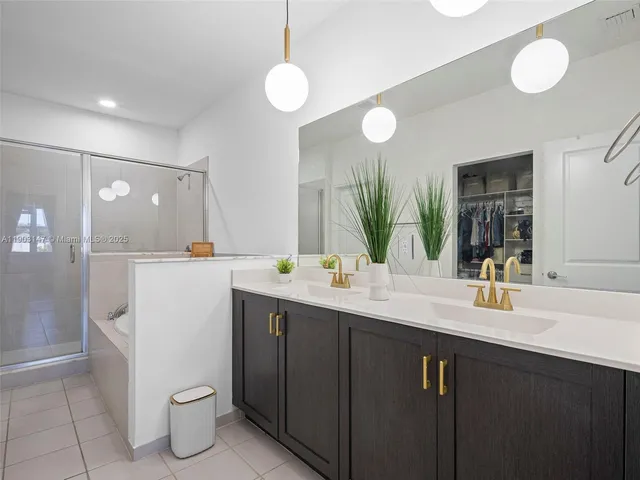 a front view of a house with a yard and a garage