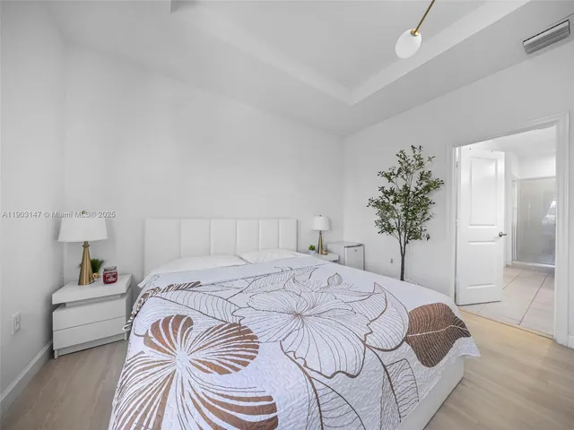 an aerial view of residential building and lake