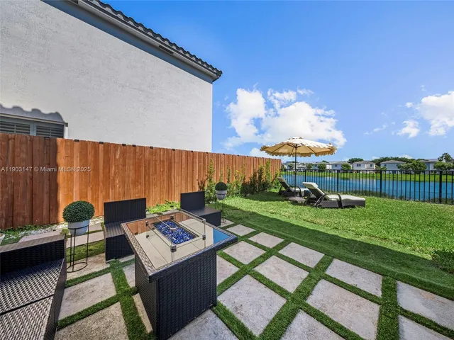 a view of entrance of the house with a yard