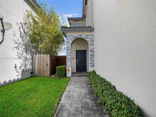 a view of a yard with furniture and a tub