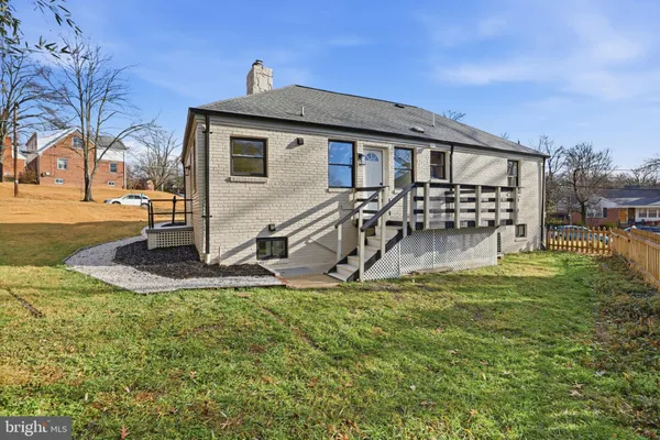 a view of a house with backyard porch and sitting area