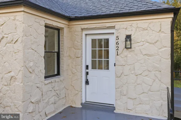 a front view of a house with a shower