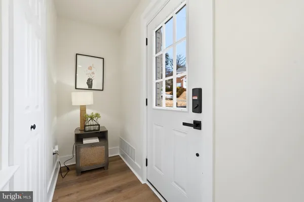 a view of an entryway with wooden floor