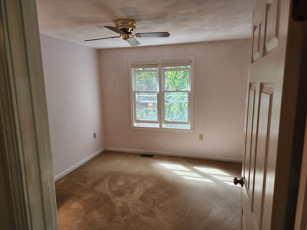 44 Lawton Road, Unit B Shirley, MA 01464 - Photo 12 of 29 a view of empty room with windows