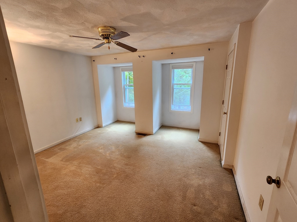 44 Lawton Road, Unit B Shirley, MA 01464 - Photo 15 of 29 a view of a big room with closet and windows
