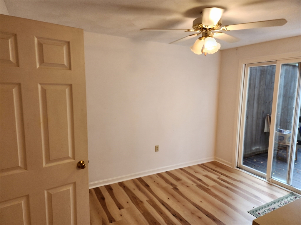 44 Lawton Road, Unit B Shirley, MA 01464 - Photo 5 of 29 a view of a room with wooden floor and fan
