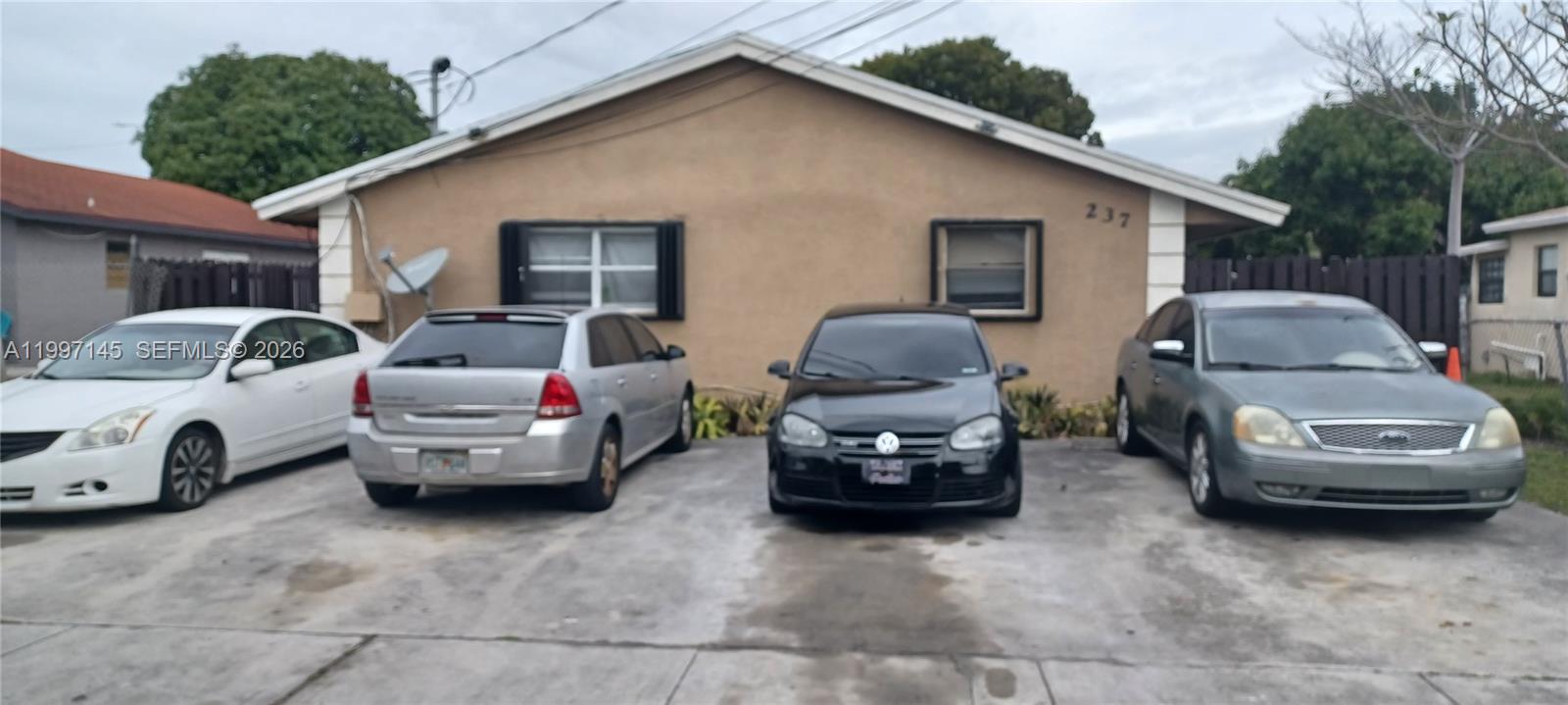 a car parked in front of a house