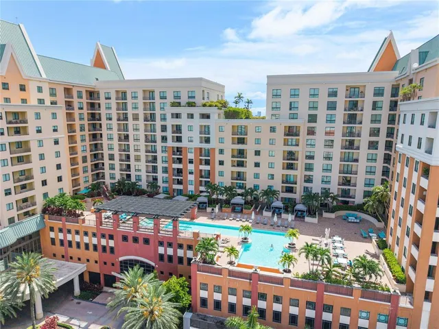 a bedroom with a bed a couch and a window
