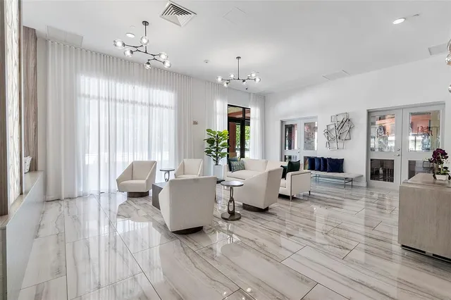 a kitchen with stainless steel appliances granite countertop a sink refrigerator and cabinets