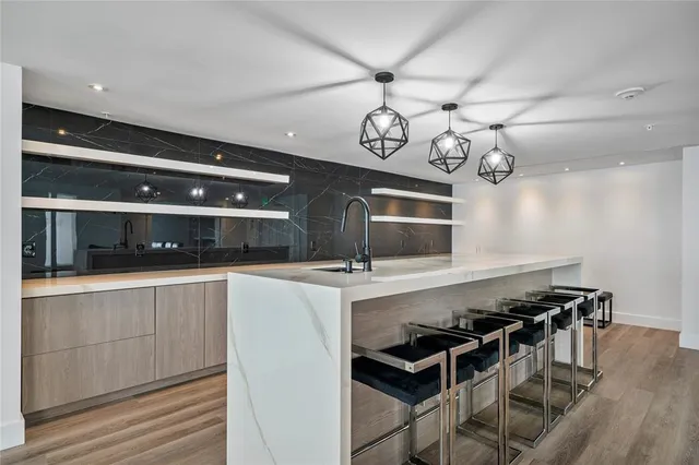 a view of a dining room with furniture and window