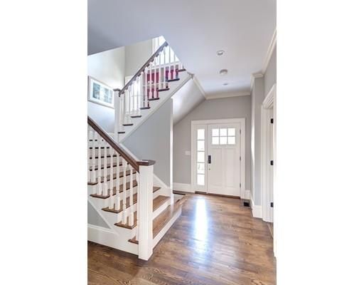 a view of entryway with stairs and wooden floor