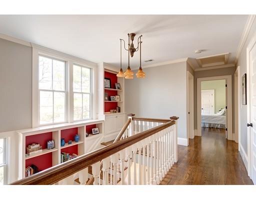106 Day Street Newton, MA 02466 - Photo 14 of 30 a view of a hallway with wooden floor and staircase