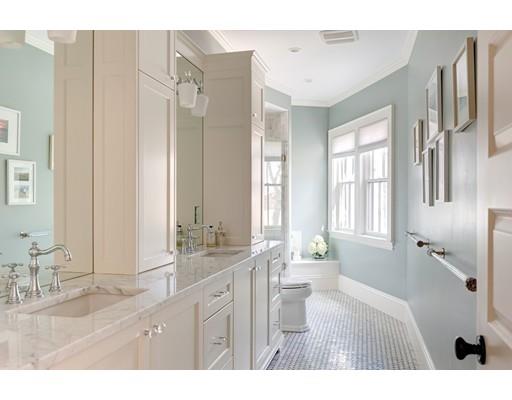106 Day Street Newton, MA 02466 - Photo 16 of 30 a bathroom with a double vanity sink a mirror and a bathtub