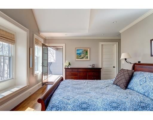 a bedroom with a large bed and a large window