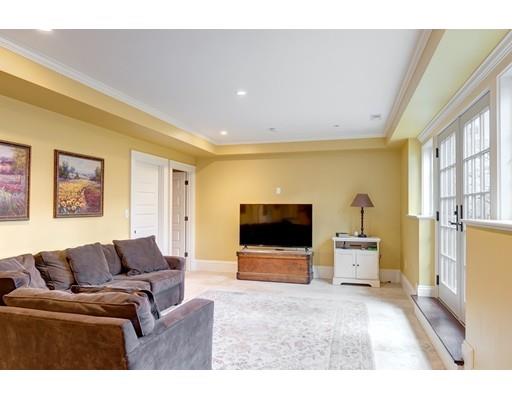 106 Day Street Newton, MA 02466 - Photo 24 of 30 a living room with furniture and a flat screen tv