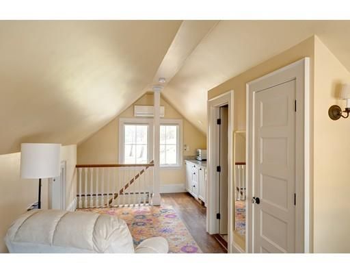 a bedroom with a bed and a lamp