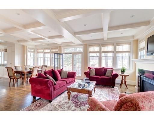 a living room with furniture large window and a table