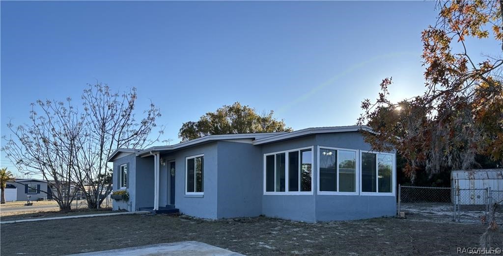 405 Copperfield Road Spring Hill, FL 34606 - Photo 4 of 25 a view of a house with a yard