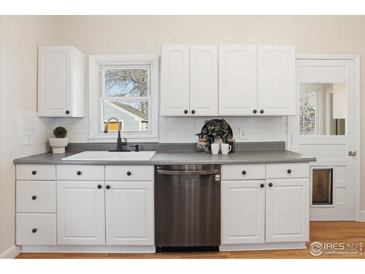 806 East Myrtle Street Fort Collins, CO 80524 - Photo 23 of 50 Kitchen with door leading to the sunroom.