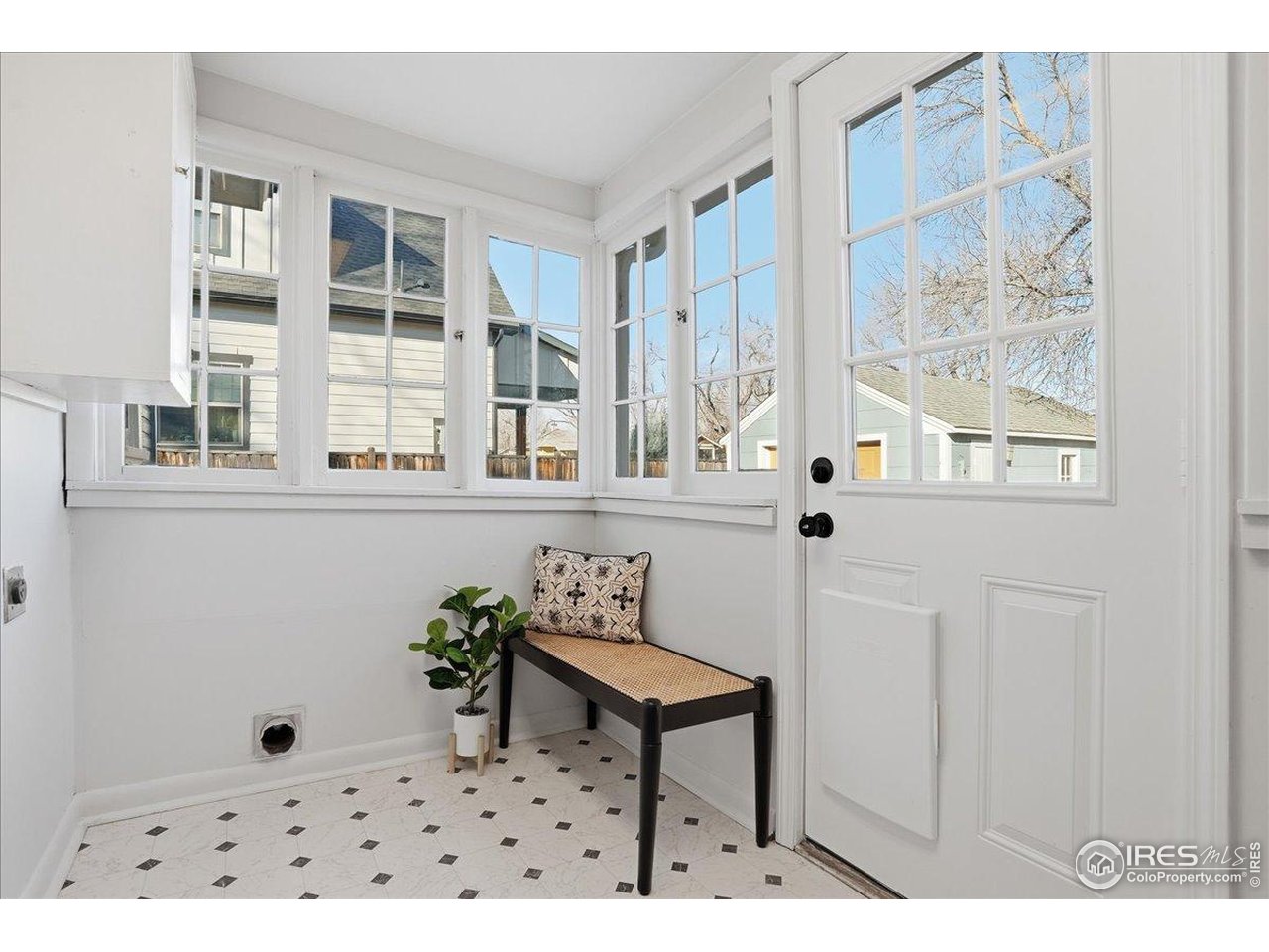 806 East Myrtle Street Fort Collins, CO 80524 - Photo 35 of 50 The sunroom offers washer/dryer hookups.