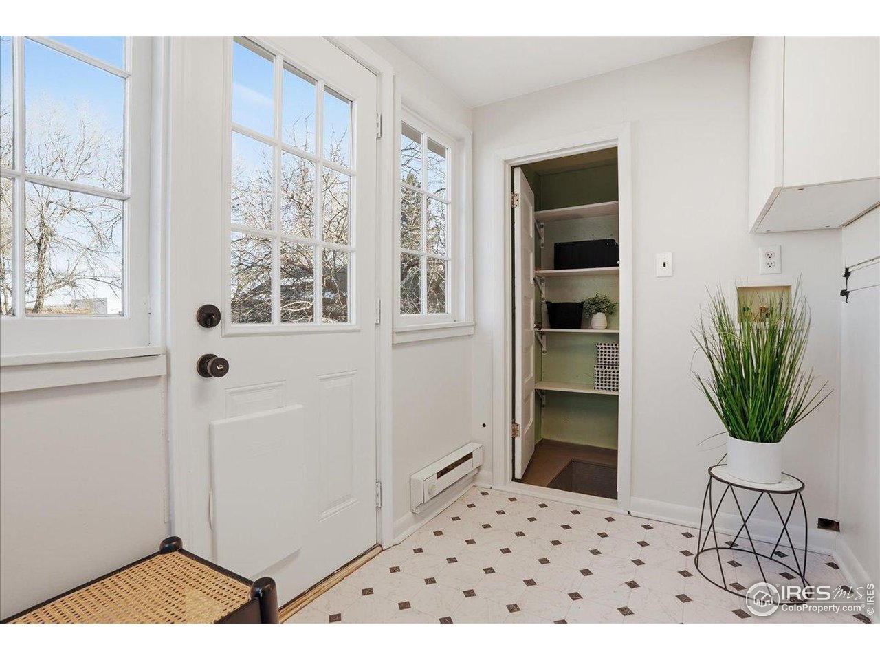 806 East Myrtle Street Fort Collins, CO 80524 - Photo 36 of 50 The sunroom leads to the spacious backyard or to the cellar for ample storage (cellar not counted in square footage).