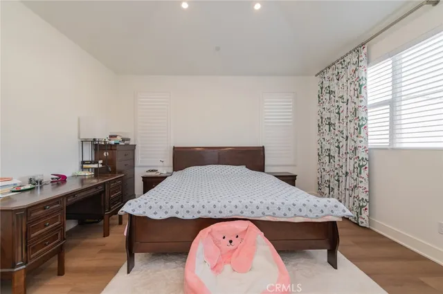 a bedroom with a bed and a table in it