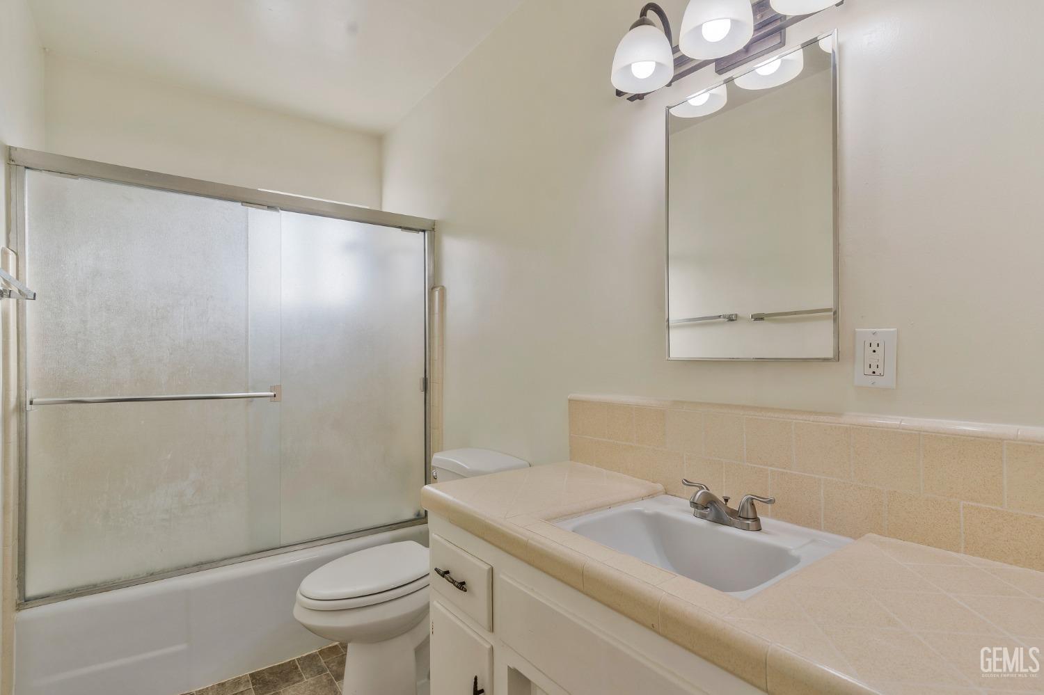 Undisclosed Address Bakersfield, CA 93304 - Photo 11 of 21 a bathroom with a sink toilet and shower