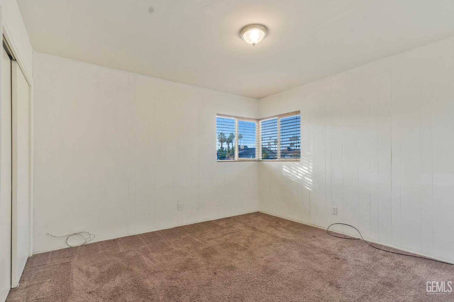 Undisclosed Address Bakersfield, CA 93304 - Photo 12 of 21 an empty room with a windows