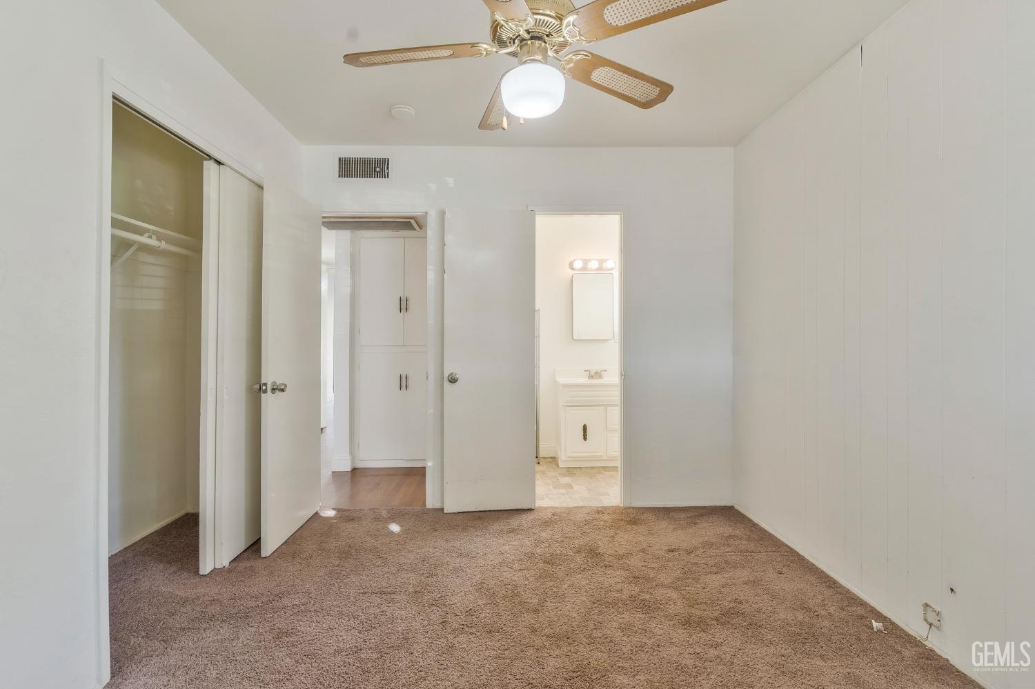 Undisclosed Address Bakersfield, CA 93304 - Photo 16 of 21 an empty room with a fan and a ceiling fan