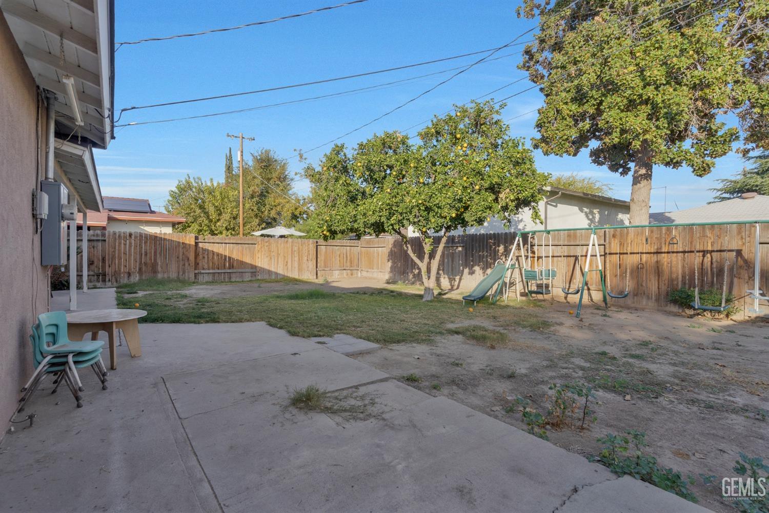 Undisclosed Address Bakersfield, CA 93304 - Photo 20 of 21 a view of backyard with outdoor seating and plants
