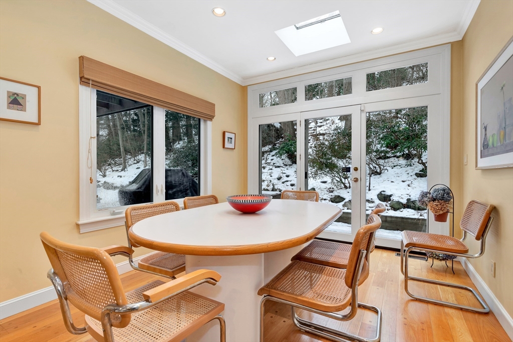 127 Gordon Road Newton, MA 02468 - Photo 14 of 24 a dining room with furniture large windows and wooden floor