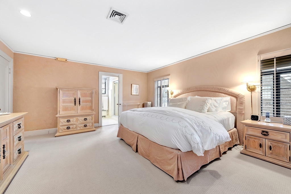 127 Gordon Road Newton, MA 02468 - Photo 16 of 24 a spacious bedroom with a bed and a couch