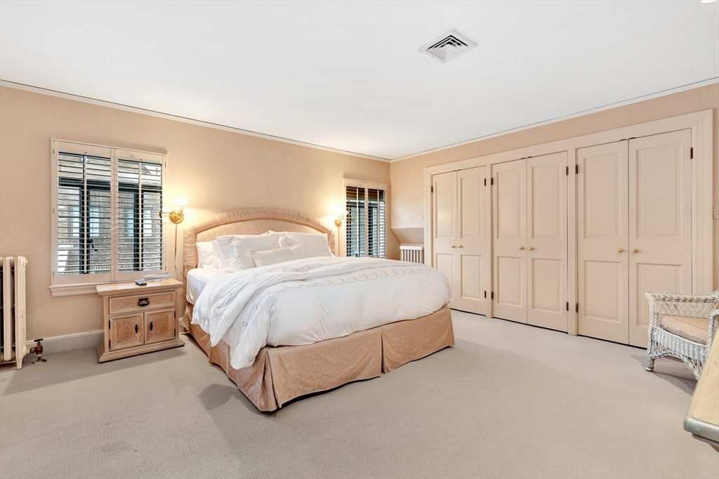 127 Gordon Road Newton, MA 02468 - Photo 17 of 24 a spacious bedroom with a bed and a window