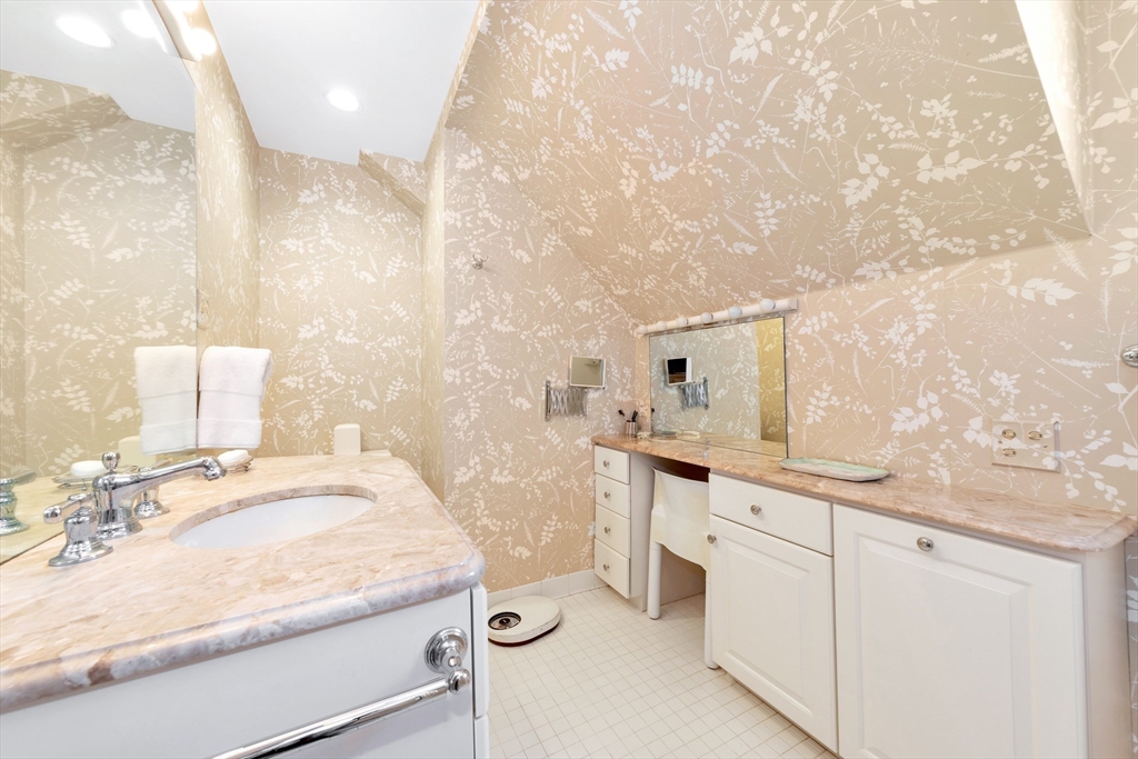 127 Gordon Road Newton, MA 02468 - Photo 18 of 24 a bathroom with a sink and a mirror