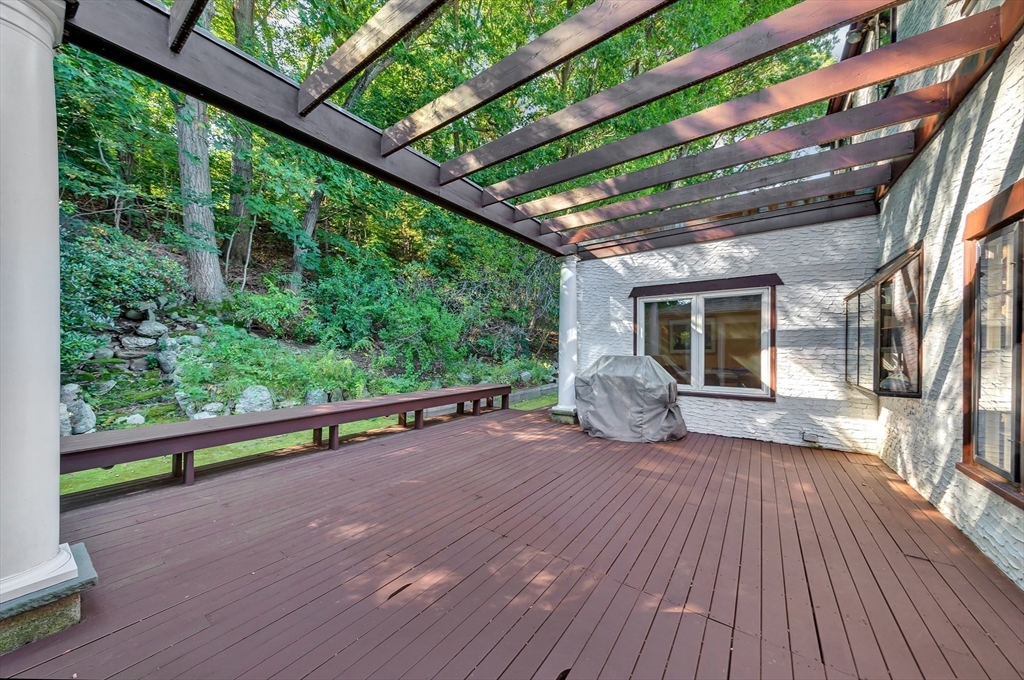 127 Gordon Road Newton, MA 02468 - Photo 22 of 24 a view of a wooden deck with a yard