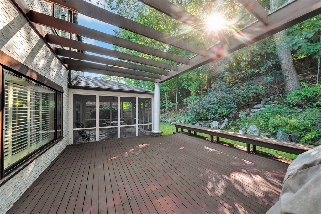 127 Gordon Road Newton, MA 02468 - Photo 23 of 24 a view of a roof deck with wooden floor and fence next to a yard