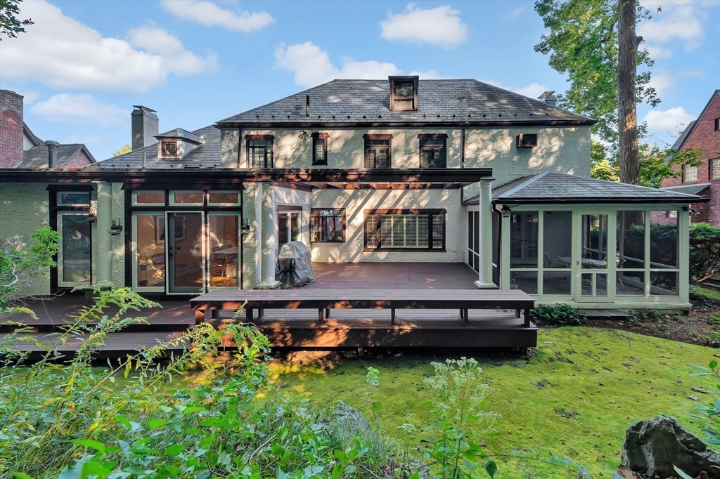 127 Gordon Road Newton, MA 02468 - Photo 24 of 24 a backyard of a house with yard table and chairs