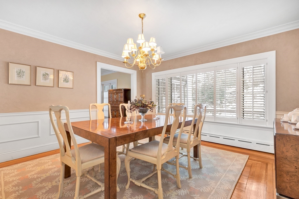 127 Gordon Road Newton, MA 02468 - Photo 9 of 24 a dining room with furniture a chandelier and wooden floor