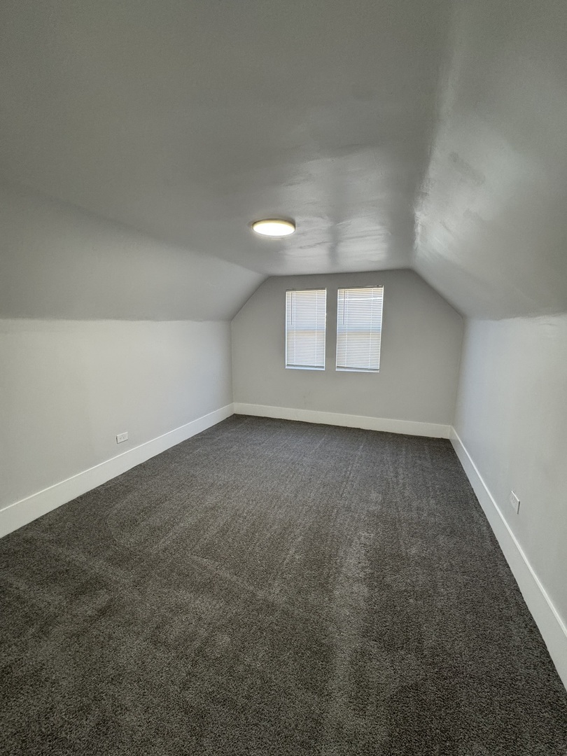 11578 South Perry Avenue Chicago, IL 60628 - Photo 8 of 11 an empty room with a window