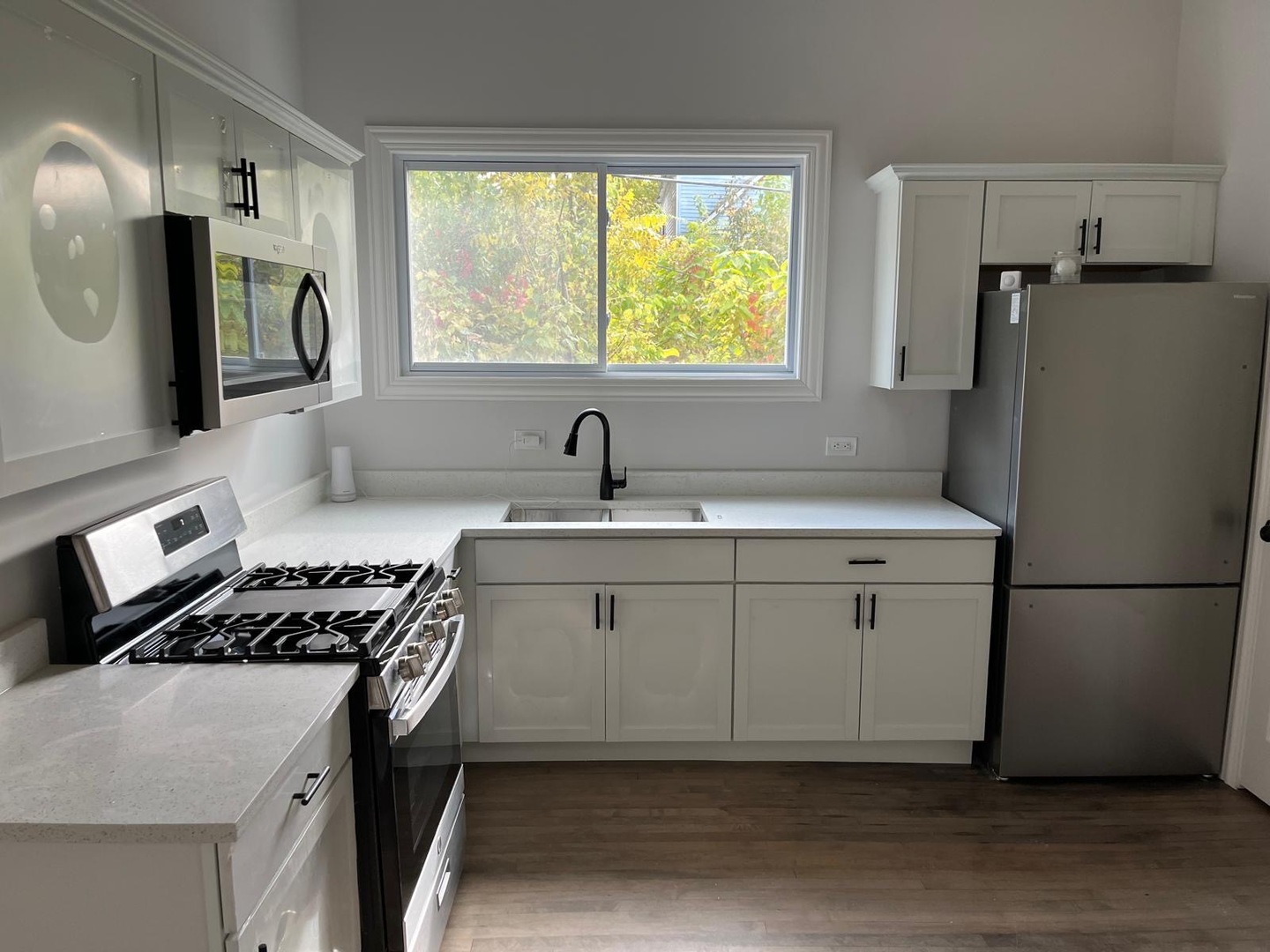 11578 South Perry Avenue Chicago, IL 60628 - Photo 10 of 11 a kitchen with a refrigerator and a sink