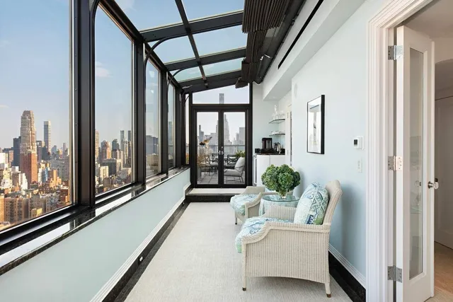 a bathroom with a glass shower door and a sink