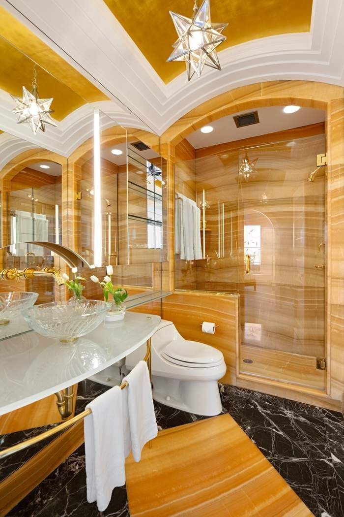 35 East 76th Street, Unit PH3407 Manhattan, NY 10021 - Photo 22 of 23 a bathroom with a toilet a sink and a shower