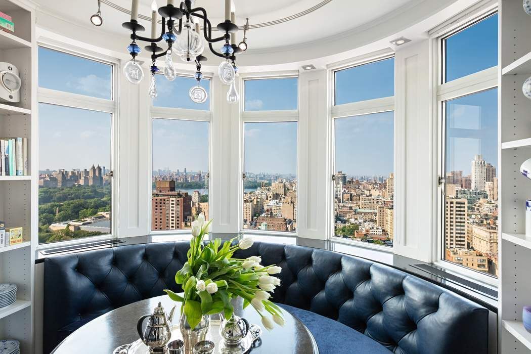 35 East 76th Street, Unit PH3407 Manhattan, NY 10021 - Photo 9 of 23 a living room with furniture and a large window