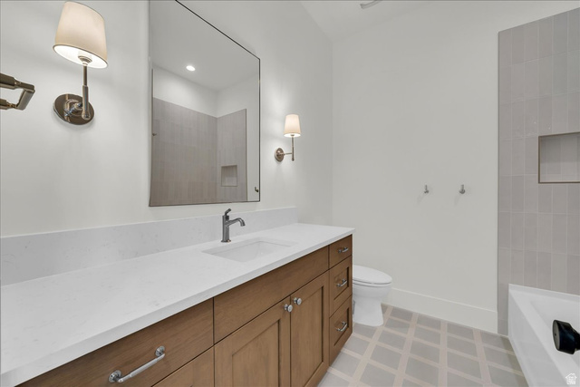 1620 Belayer Drive St. George, UT 84770 - Photo 29 of 51 White solid surface countertop with integrated sink, wood-finish vanity cabinetry, and brushed nickel hardware