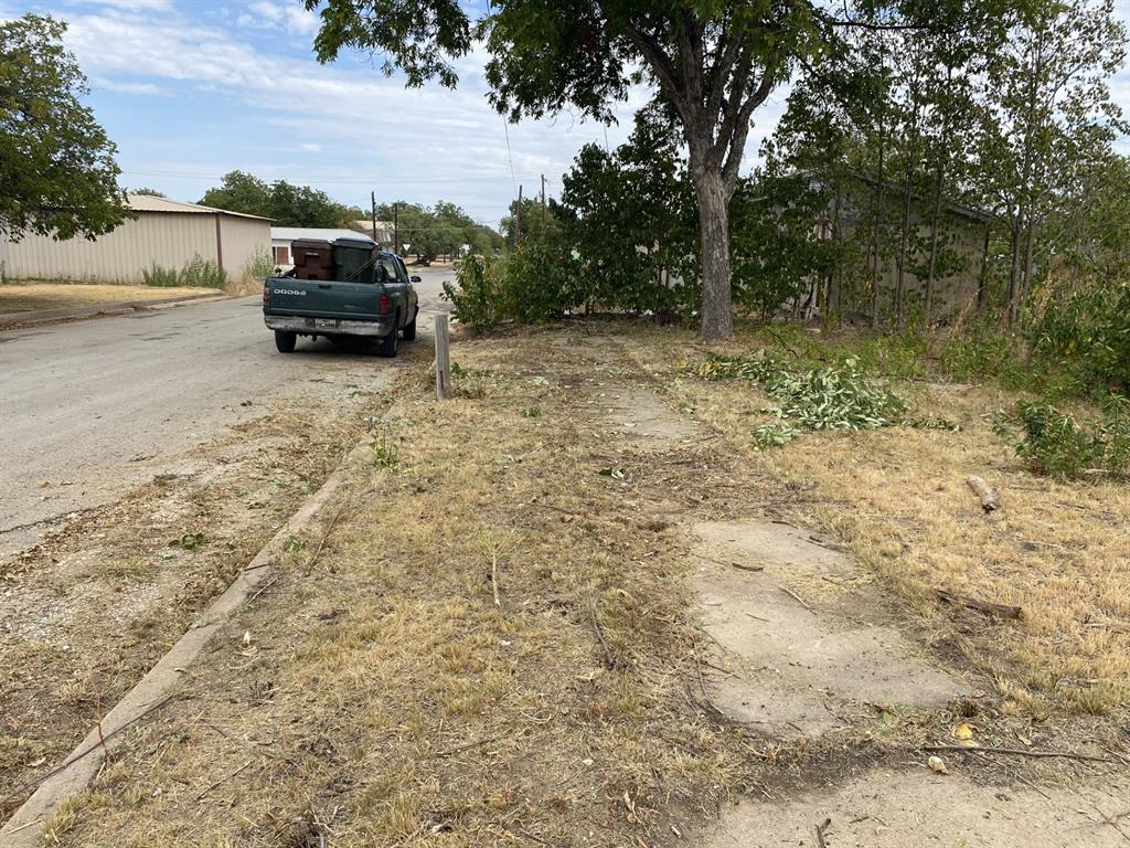 217 West 3rd Street, Unit A Coleman, TX 76834 - Photo 2 of 3 a view of backyard with car parked