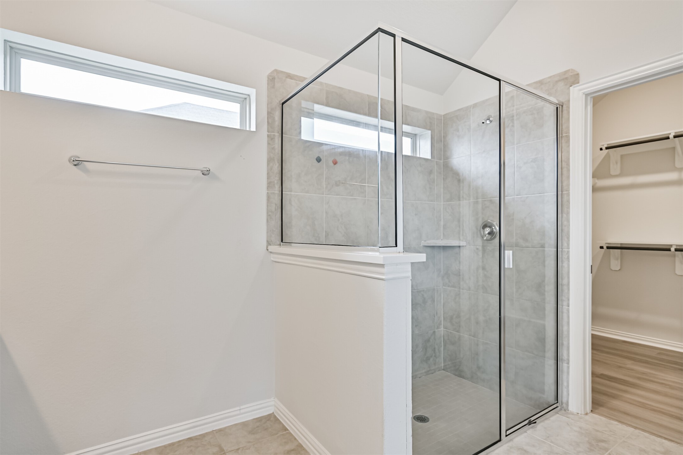 7019 Terra Drive Manvel, TX 77578 - Photo 36 of 41 a bathroom with a glass shower door
