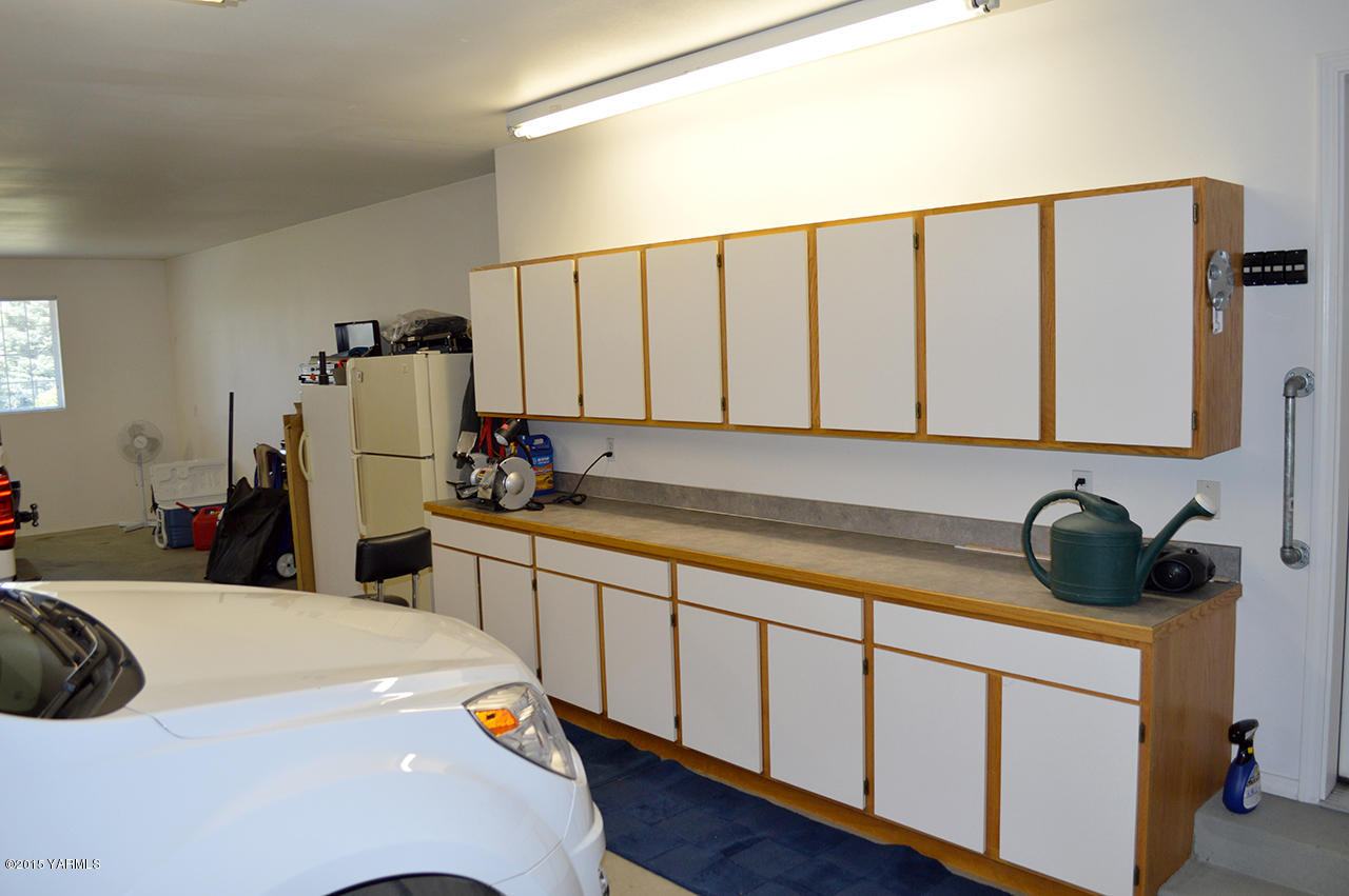 8104 Rutherford Road Yakima, WA 98903 - Photo 24 of 42 a kitchen with a sink and cabinets